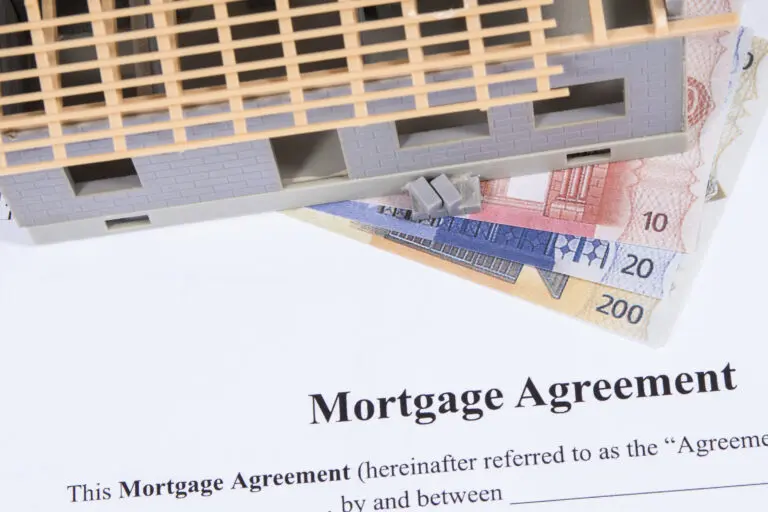 Small house under construction, mortgage agreement form and Euro